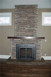 clean classic stone veneer fireplace